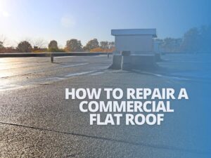 A professional roofer repairing a flat roof
